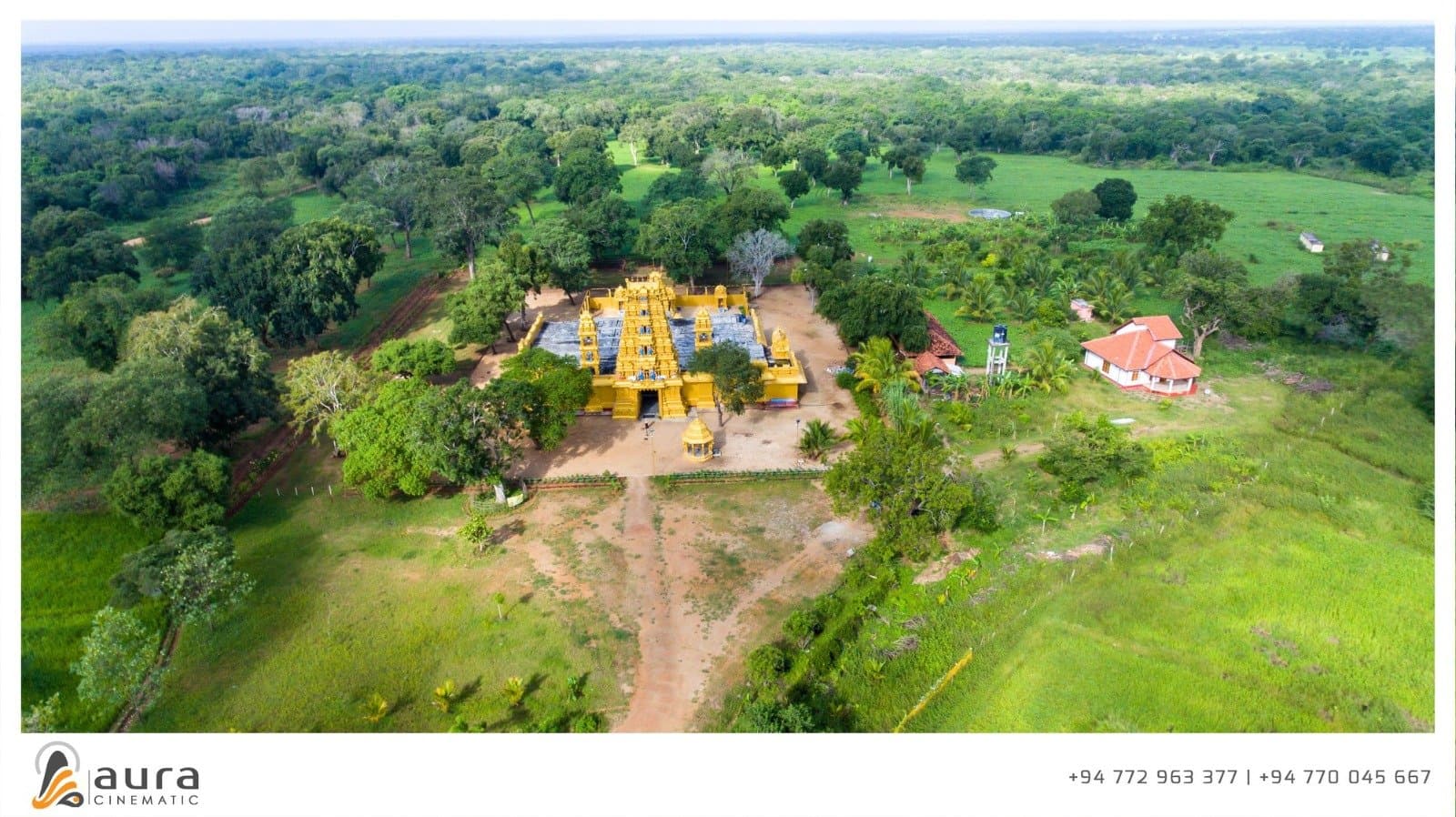 Wide aerial view showing the temple amidst Vavuniya's green countryside