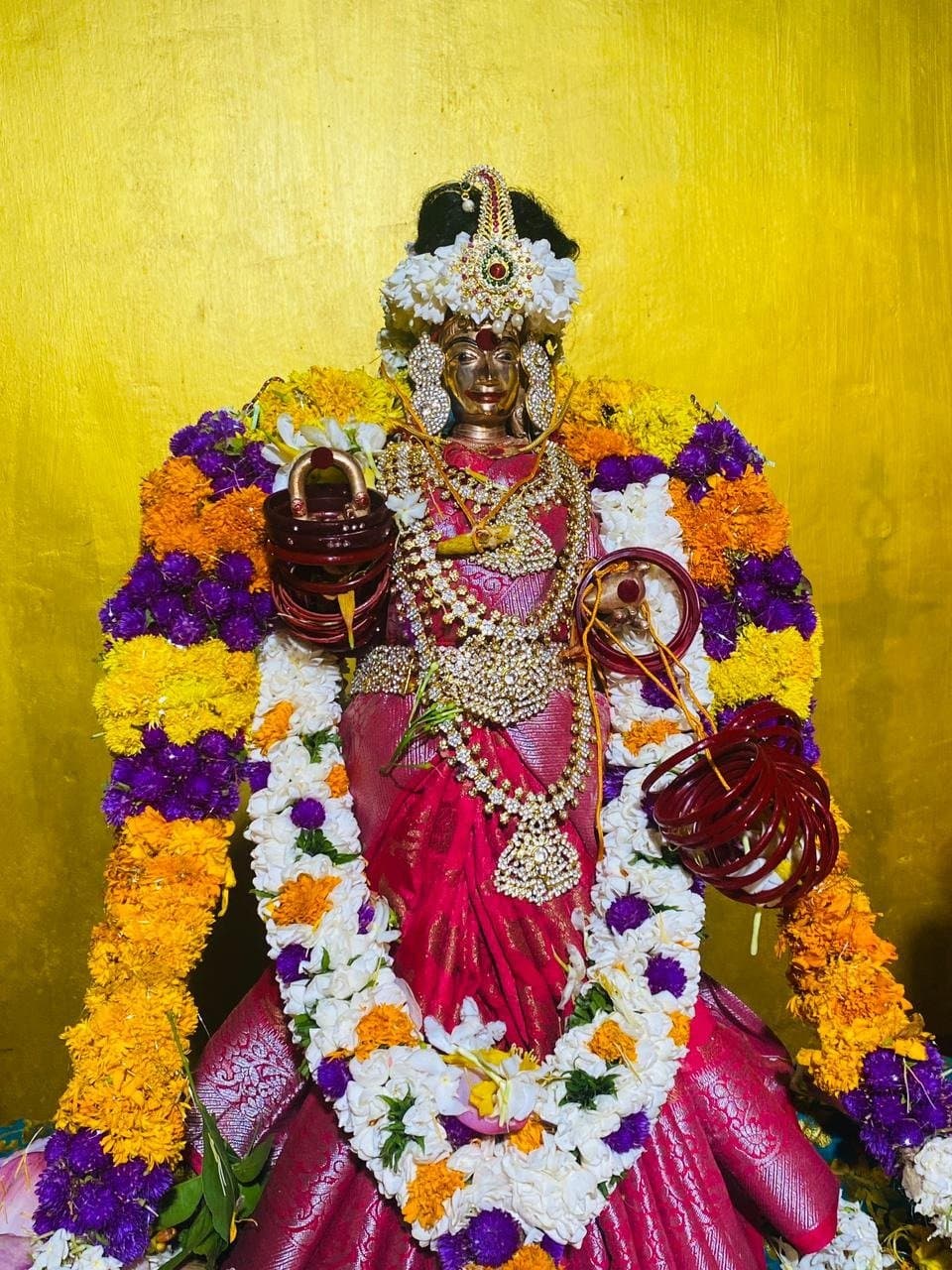 Sri Kannagi Amman in pink silk with floral garlands