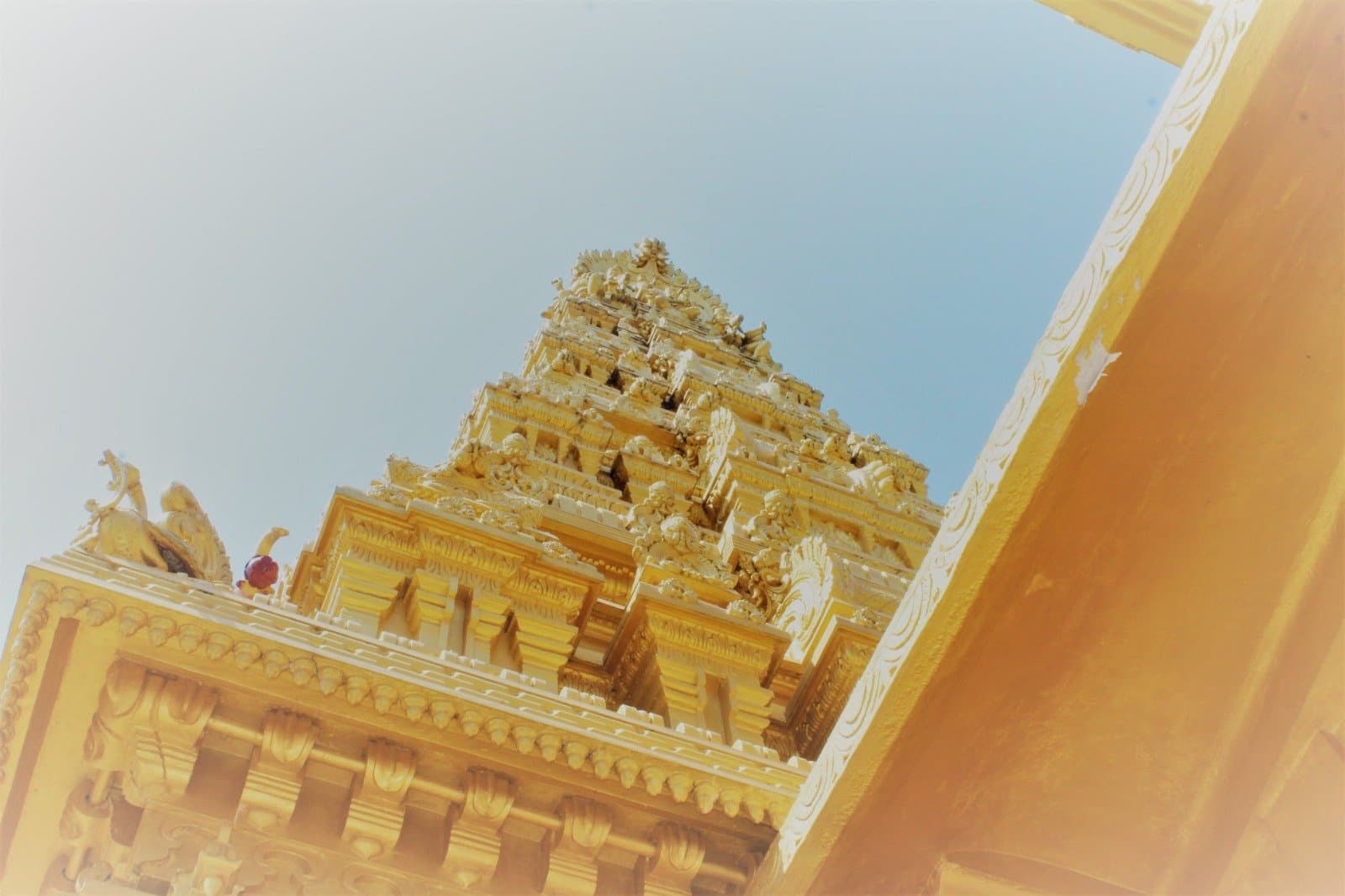 Gopuram seen from below — looking upward to its sculpted spire