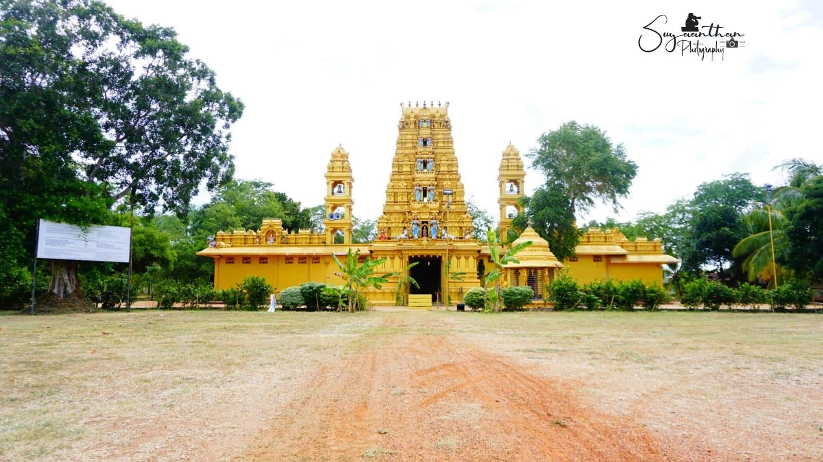 Wide front view of the temple complex showing the full gopuram and outer walls