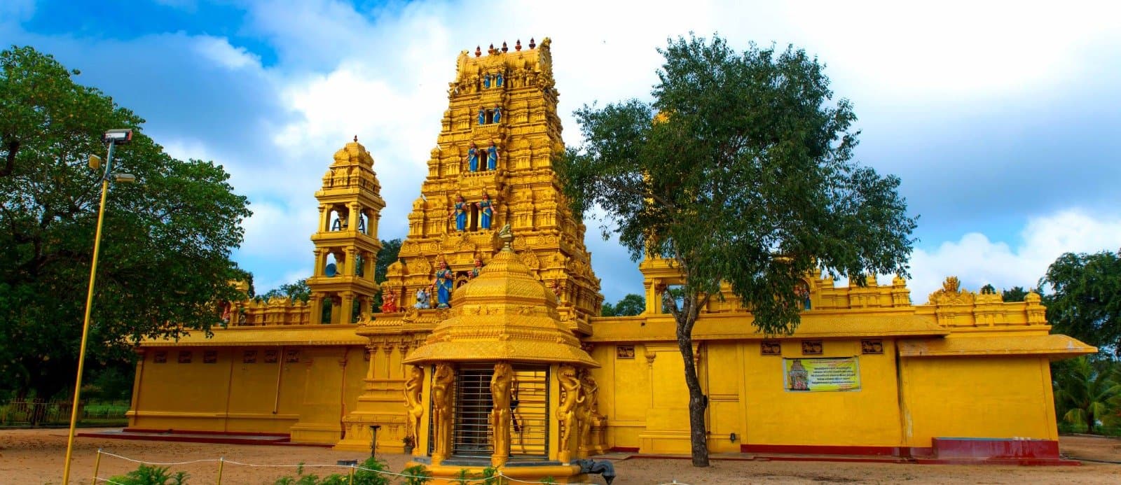 Panoramic side view of the temple with bell tower and central shrine